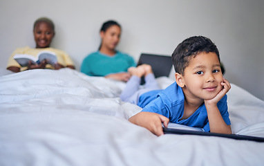 Image showing Kid, tablet and happy portrait in bed at family home in the morning with lgbt parents feeling relax. Bedroom, education app and house with a young child smile online with mother and kids website