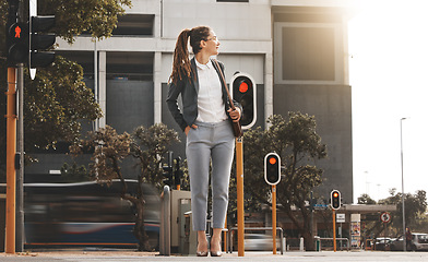 Image showing City, walking and woman on a crosswalk wait with travel, business commute and urban journey. Road, outdoor and female professional in morning traveling for work, career and job in New York on street