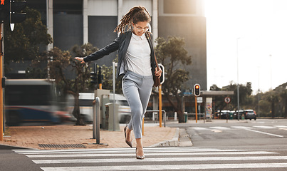 Image showing City, walking and business woman on a crosswalk with travel, commute and urban journey. Running, outdoor and female professional in morning traveling for work, career and job in New York on street