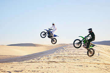 Image showing Motorcycle, desert and jump in air, speed and competition at outdoor race for performance, goal or off road. Motorbike athlete, dune and ramp in nature, sand or together for training in mockup space