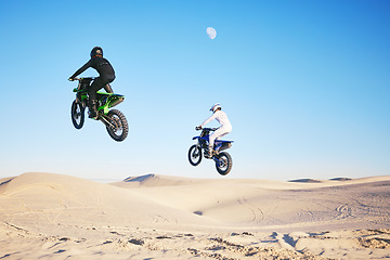 Image showing Motorcycle, desert and jump in sky, speed and competition at outdoor race for performance, goal or off road. Motorbike athlete, dune and ramp in nature, sand or together for training in mockup space