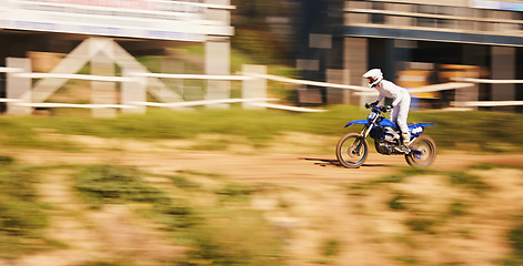 Image showing Race, motorcycle and extreme sports, man with speed for practice, training and action adventure. Fast professional dirt road biking, motion and biker in motorbike competition, performance and stunt.