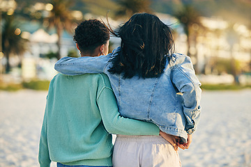 Image showing Beach, lesbian or back of gay couple walking with love, care and pride in LGBTQ community with support. Hugging, queer women or people in nature on romantic date or commitment on holiday vacation