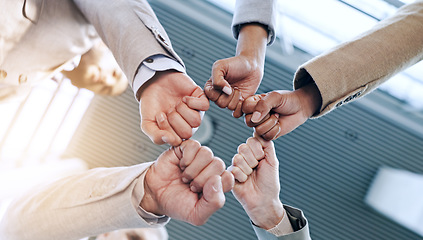 Image showing Support, teamwork or business people fist bump in huddle for motivation, group mission or collaboration. Team building, low angle or hands of colleagues in meeting with goals, vision or solidarity