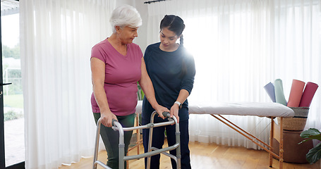 Image showing Physiotherapy, senior woman and walking frame support, Physical therapy consultation and muscle health. Elderly person or patient with disability and nurse, chiropractor or doctor helping in studio