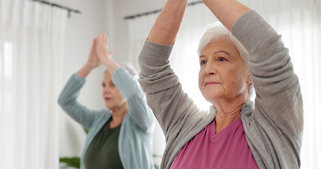 Image showing Senior women, yoga and class with friends and retirement home caregiver with a smile. Fitness, elderly group and workout for wellness and health with nurse in a living room with exercise to relax