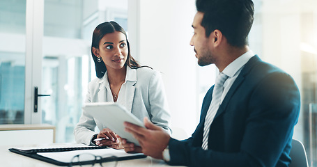 Image showing Tablet, meeting and partnership with business people working in an office as a team for research. Technology, planning or teamwork with a man and woman employee reading information in the workplace