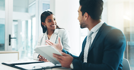 Image showing Tablet, meeting and partnership with business people working in an office as a team for research. Technology, planning or teamwork with a man and woman employee reading information in the workplace