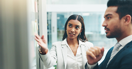 Image showing Business people, teamwork and brainstorming on glass in office for agenda, collaboration and planning ideas. Man, woman and employees at board for feedback of schedule, mindmap and timeline of goals