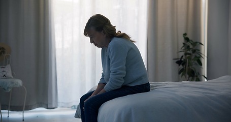 Image showing Crying, depression and sad woman in bedroom with anxiety, mental health problem or debt in retirement. Lonely, worried and frustrated senior female person at home with headache, fatigue or bad crisis