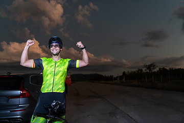 Image showing Triathlete in professional gear running early in the morning, preparing for a marathon, dedication to sport and readiness to take on the challenges of a marathon.