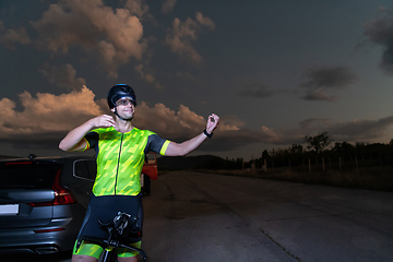 Image showing Triathlete in professional gear running early in the morning, preparing for a marathon, dedication to sport and readiness to take on the challenges of a marathon.