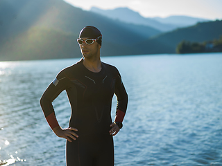 Image showing A triathlon swimmer preparing for a river training to gear up for a marathon