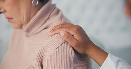 Image showing Sympathy, consoling and closeup of caregiver with woman after cancer diagnosis in retirement home. Healthcare, consultation and zoom of elderly female patient with hand of doctor at checkup in room.