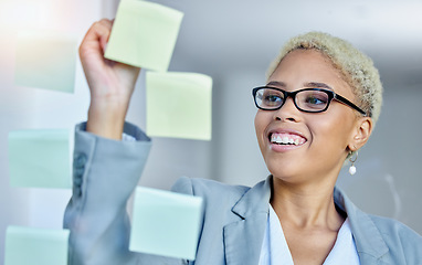 Image showing Writing, planning and happy business woman in office with sticky note goal, idea or strategy. Schedule, smile and happy female manager brainstorming calendar, mission or agenda, management or growth