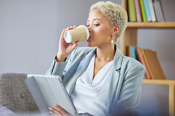 Image showing Coffee break, tablet and business woman on a sofa relax, reading and checking email while working remote. Freelance, tea and female in living room with social media, search and ebook in her home