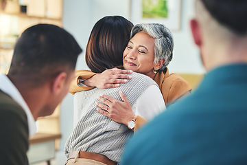 Image showing Business people, women and hug in group therapy with smile, care and bonding for mental health in workplace. Corporate men, staff and colleagues with embrace for team building, love or thank you