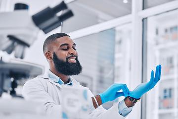 Image showing Scientist, black man and gloves in medical research at laboratory to start science analysis, test or experiment. Happy doctor, ppe or professional in preparation in investigation, assessment or study