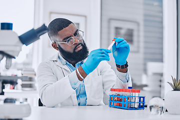 Image showing Sample analysis, research and a scientist with blood for science or pharmaceutical healthcare in a lab. Focus, doctor or a black man with a dna vial for virus test, technician work or expert check