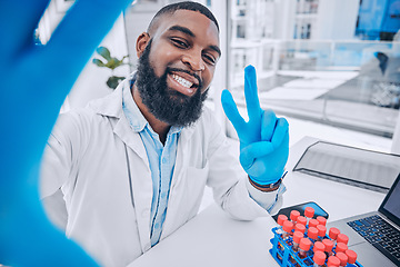 Image showing Scientist, portrait of man and peace for selfie in medical laboratory, research investigation and testing. Face of african science expert smile for profile picture with v sign, emoji and social media