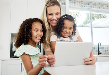Image showing Blended family, adoption and a mother with her children on a tablet in the kitchen for education or learning. Children, diversity and study with woman teaching her girl kids in their home together