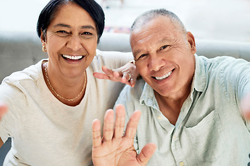 Image showing Mature couple, waving and selfie on home sofa for video call, streaming and internet. A happy man and woman together on a couch for social media profile picture, hello or memory of healthy marriage