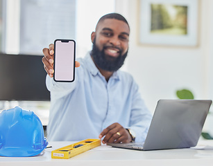 Image showing Black man, engineer or phone mockup in office for communication, construction update or networking. Smile, screen or portrait of happy architect on mobile app display or mock up space on Internet