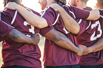 Image showing Hug, sports and men at game for rugby, team support or solidarity for a competition. Back, motivation and men or athlete teamwork with a huddle, collaboration and friends with community on a field