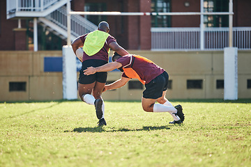 Image showing Rugby, sports and tackle with a team on a field together for a game or match in preparation of a competition. Exercise, health and teamwork with a group of men outdoor on grass for club training