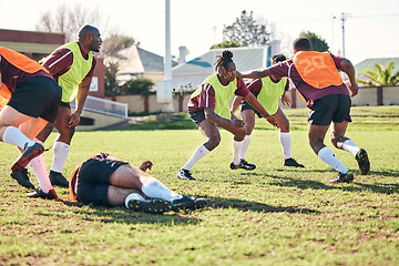 Image showing Rugby, sports and running with a team on a field together for a game or match in preparation of a competition. Fitness, training and teamwork with a group of men outdoor on grass for club practice