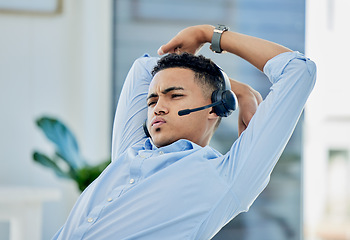 Image showing Tired, stretching and man in call center with stress for telemarketing, customer service and sales consulting. Lazy, uncomfortable and male agent on a break for burnout, fatigue or bored at help desk