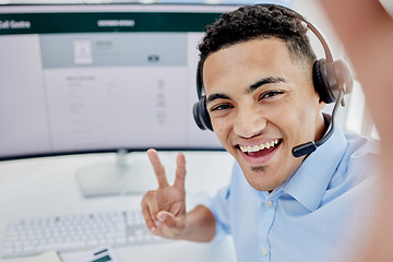 Image showing Man, call center selfie and happy communication, customer service and e commerce on computer screen and peace sign. Consultant portrait, agent face or business person for profile picture on desktop