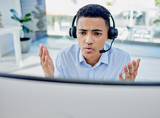 Image showing Customer support, telemarketing and upset male consultant in the office doing an online consultation. Contact us, stress and professional man call center agent on a call with headset in the workplace