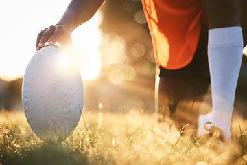 Image showing Rugby, ball closeup and sun, sports on field outdoor with bokeh, target with fitness and train for match. Exercise, athlete person hand and game with practice, health and active with player and ready