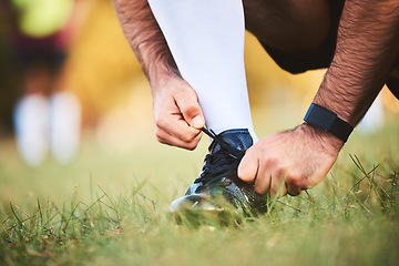 Image showing Hands, rugby athlete and tie shoes to start workout, exercise or fitness. Sports, player and man tying boots in training preparation, game or competition for healthy body or wellness on field outdoor