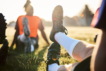 Image showing Rugby, stretching legs and people on field for sports, team training or together in the morning. Grass, fitness and athlete players with a warm up for a game, workout or performance in a competition