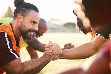 Image showing Rugby, shaking hands and team exercise, training or cooperation at sunrise. Handshake, sports partnership and happy athlete group in trust agreement, solidarity and workout, fitness and collaboration