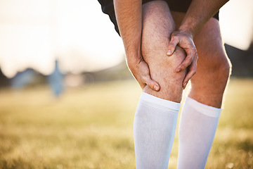 Image showing Knee pain, man with injury and exercise accident, athlete outdoor with cramps and muscle tension. Fitness, sports and male person with hands on leg, health crisis and rugby player with inflammation