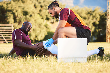 Image showing Black man, knee pain and injury, medic help athlete and sports accident on field with health and wellness. Bandage leg, male healthcare worker and support with medical care, inflammation and fracture