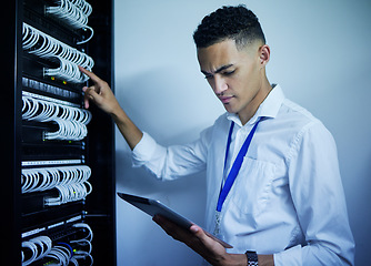 Image showing Man, engineering and tablet in server room or data center inspection, system solution or cybersecurity management. Electrician person on digital technology by power cables, electricity or programming