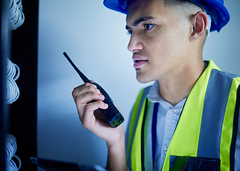 Image showing Man, engineering and radio in server room for communication, power update and inspection. Young technician, electrician or contractor check cables, security system or electricity with walkie talkie