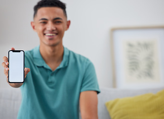 Image showing Phone screen, mockup and portrait of man on sofa for networking, social media and space. Internet, show and mobile app with person in living room of home for ui, communication and website offer