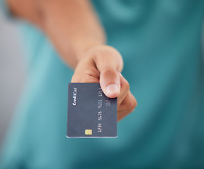 Image showing Person giving credit card, hand and finance with payment, shopping and closeup with retail and store discount. Financial service, customer or client and economy with commerce, transaction and banking