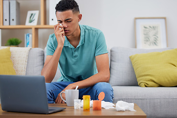 Image showing Young man, sofa and sick with virus, laptop and streaming online or research about symptoms, medicine and health. Male person, healthcare and browse on pc with pills, pharmaceutical and drugs for flu