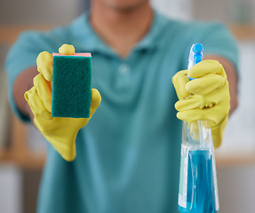 Image showing Hands, sponge and spray for cleaning of a home, gloves for safety and detergent bottle. Closeup, showing and a cleaner or person with product for apartment maintenance or house service as a job