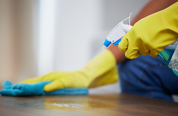 Image showing Cleaning spray, wipe and hands of a person on a table for dust, housekeeping service and morning routine. Dirt, hygiene and cleaner with liquid detergent for a sanitary counter for a fresh home