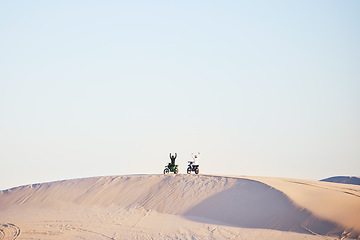 Image showing Motorbike, race celebration and desert on sand, competition or outdoor hill for sky background, goal or off road. Motorcycle athlete, ramp and nature with win, success and contest with mockup space