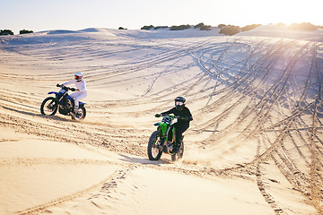 Image showing Motorcycle, desert dune and race for speed, competition or outdoor hill for performance, goal or off road. Motorbike athlete, trail or ramp in nature, sand or together for training in summer sunshine