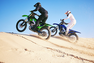 Image showing Motorcycle, desert dune and fast in race, contest or outdoor hill climb for performance, goal or off road. Motorbike athlete, launch or ramp in nature, sand or speed for training in summer sunshine