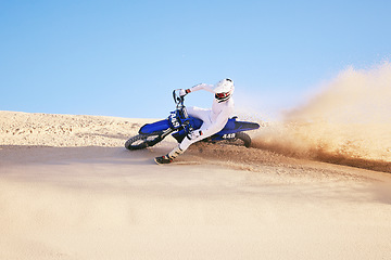 Image showing Bike, sand and sports with a man in the desert for adrenaline, adventure or training in nature. Moto, exercise and dust with a male athlete moving on dunes for freedom, energy or balance in summer